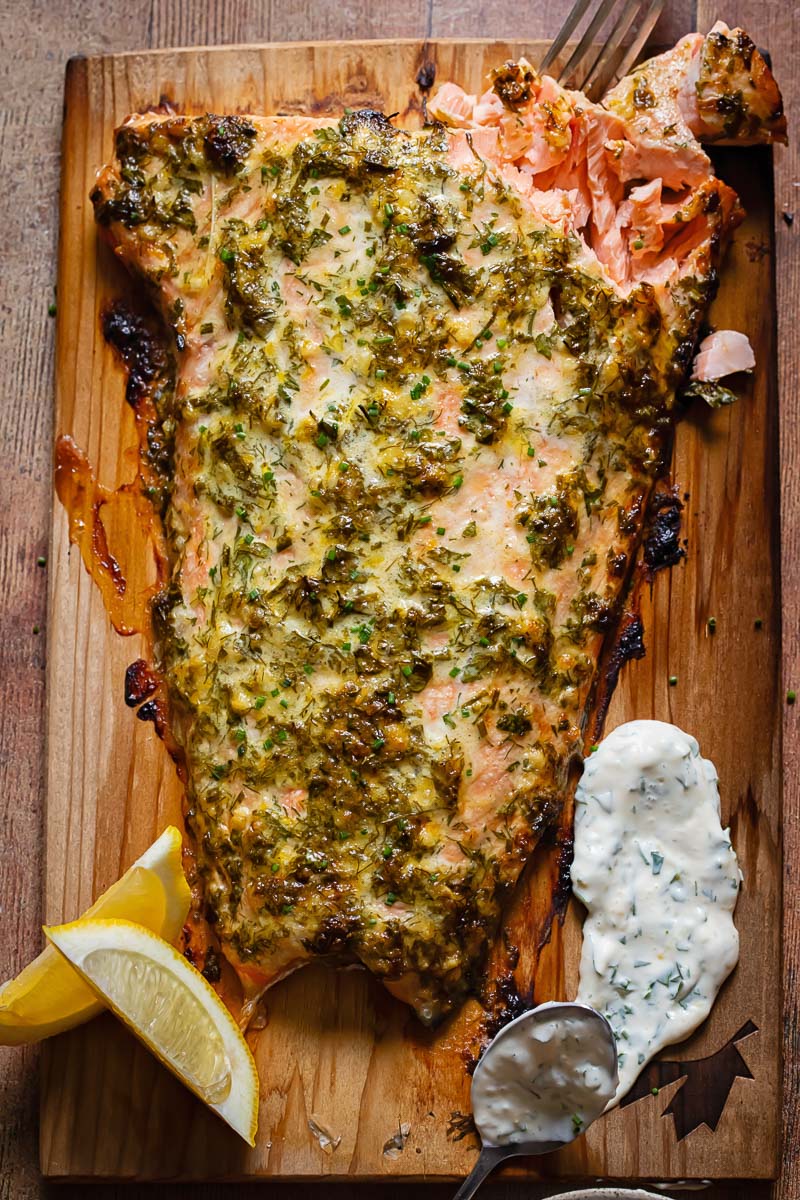 Top down shot of cedar plank salmon on a cutting board