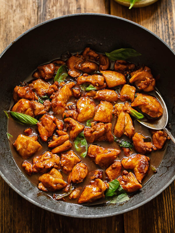 Top down shot of three cup chicken in a pan
