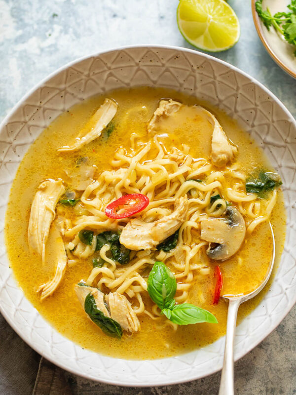 Thai chicken noodle soup in a bowl with a spoon