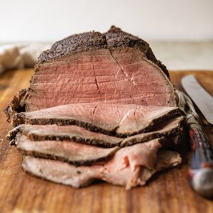 view of a roast beef with slices folded in front