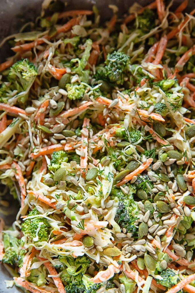 Close up of broccoli slaw salad with dill dressing