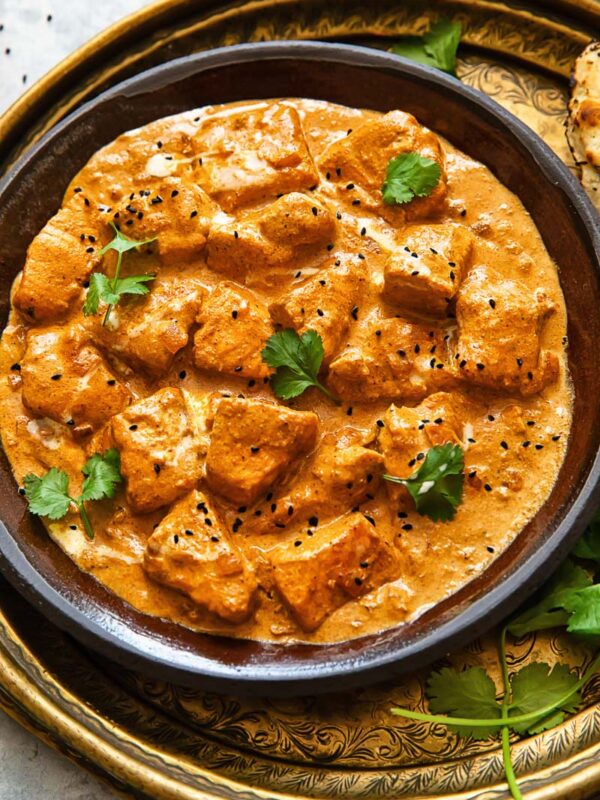 Top down shot of butter salmon chicken on a plate