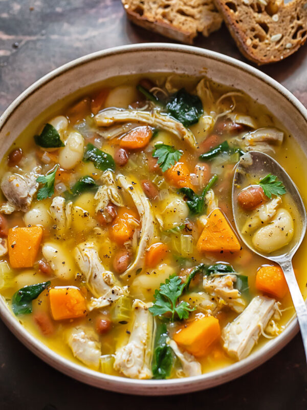 Top down shot of chicken and bean soup in a bowl
