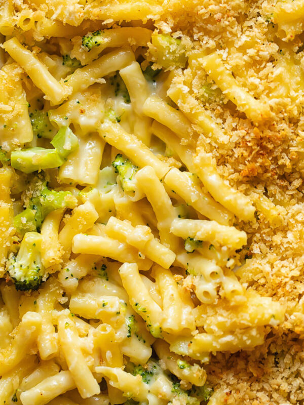 Close up shot of broccoli mac and cheese topped with breadcrumbs