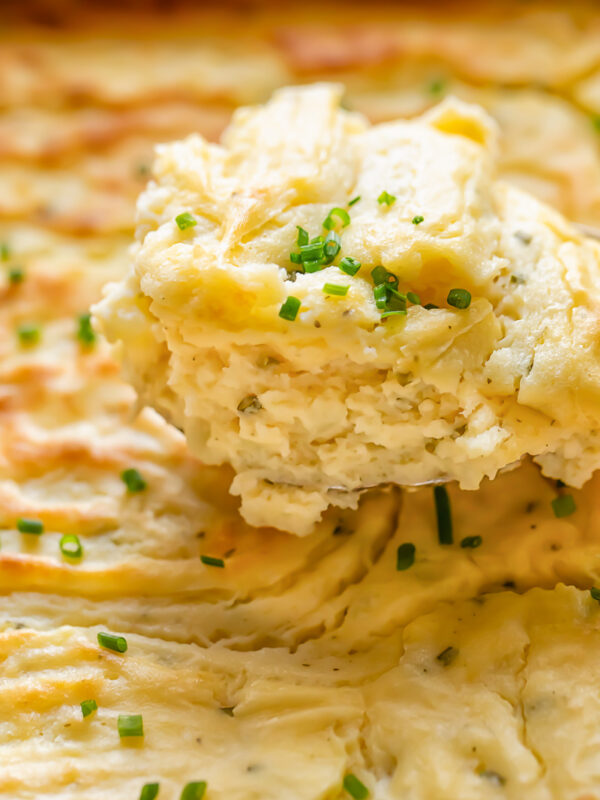 Portion of potato soufflé with sprinklings of chives on top