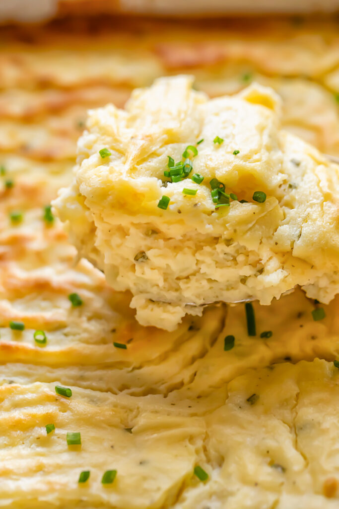 Portion of potato soufflé with sprinklings of chives on top