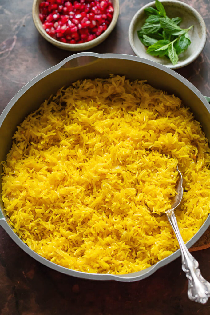 Top down shot of saffron rice in a wide pan
