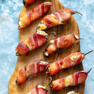 jalapeno poppers arranged on a cutting board