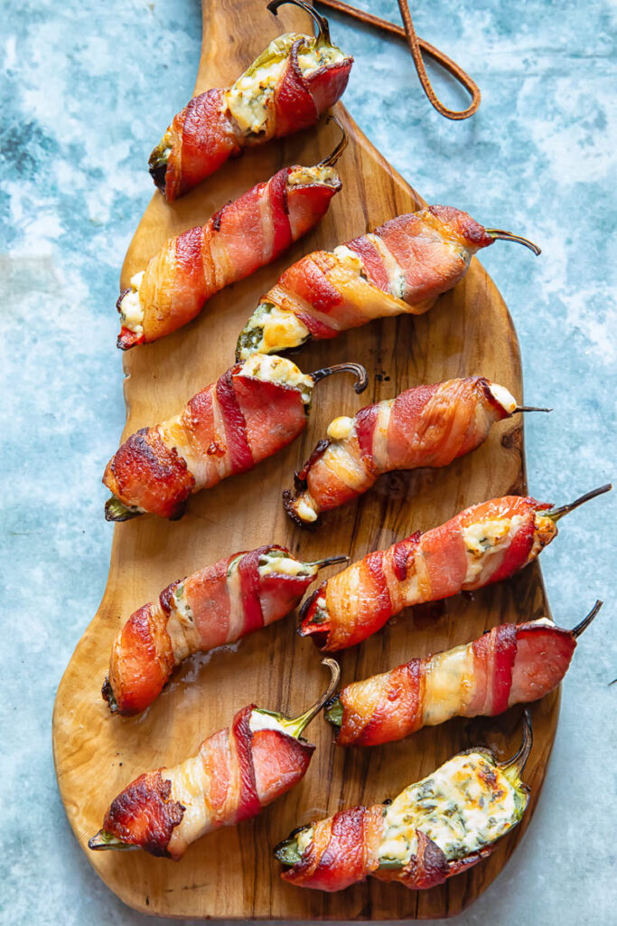 jalapeno poppers arranged on a cutting board