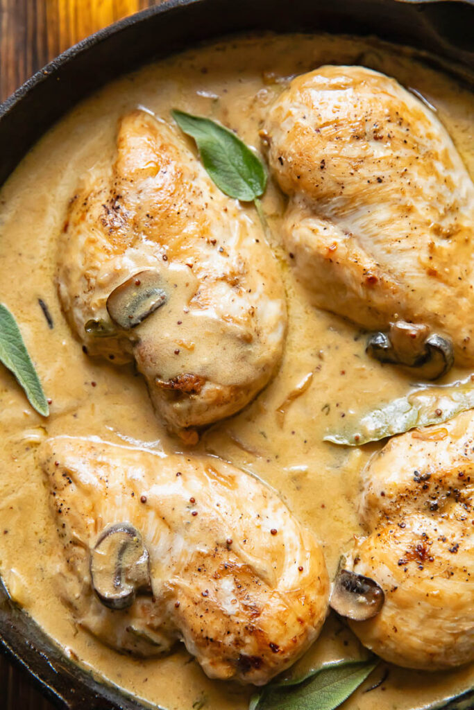 Close up of somerset chicken in a large pan