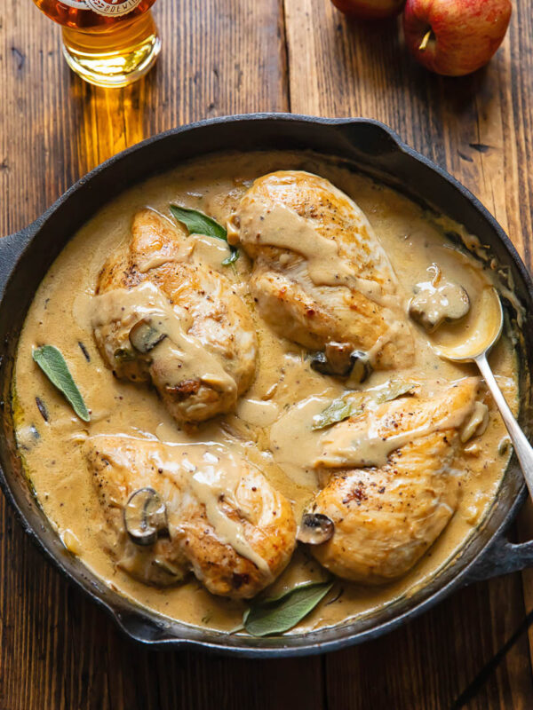 Top down shot of somerset chicken in a pan with creamy cheese sauce