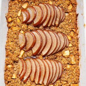 baking pan with baked oatmeal topped with thinly sliced pears