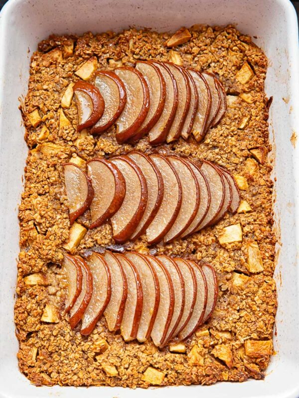baking pan with baked oatmeal topped with thinly sliced pears
