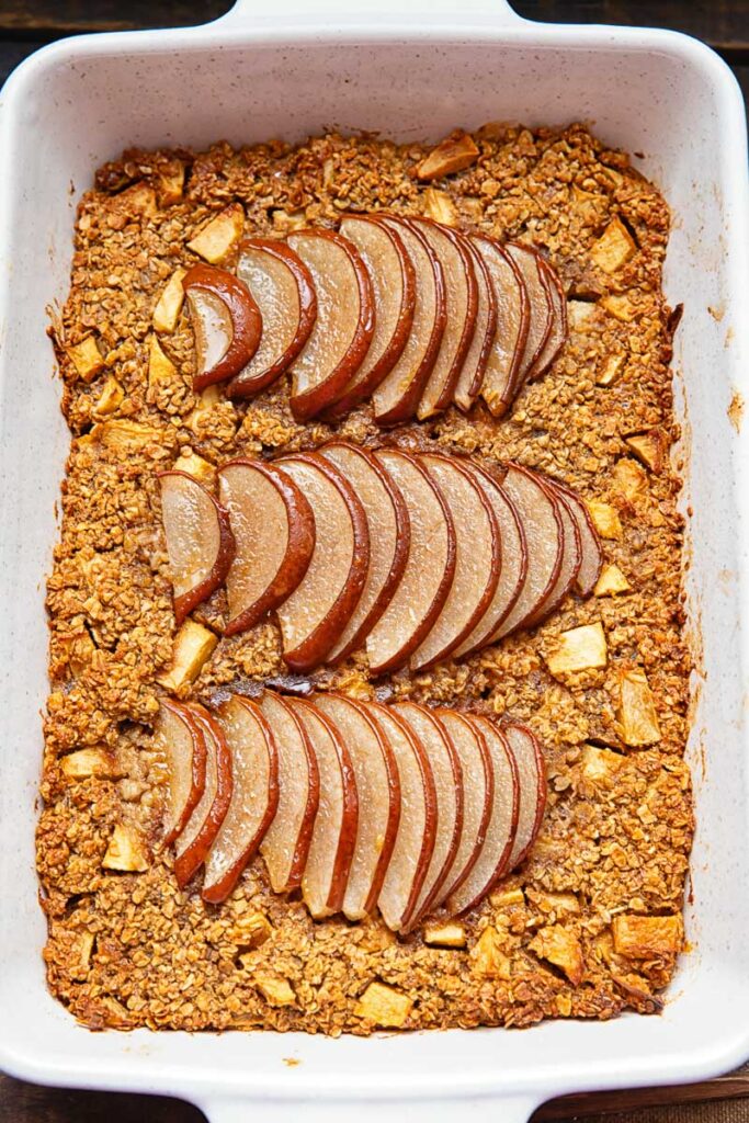 baking pan with baked oatmeal topped with thinly sliced pears