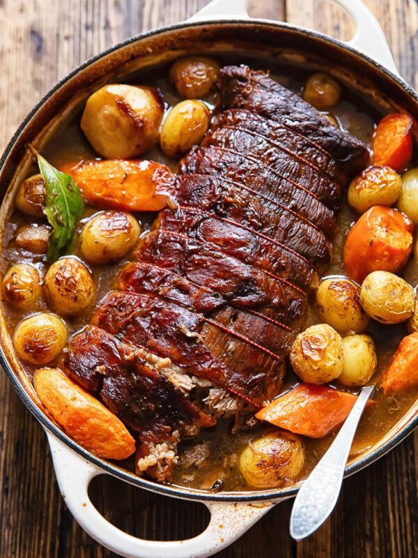 Top down shot of beef pot roast with potatoes and carrots