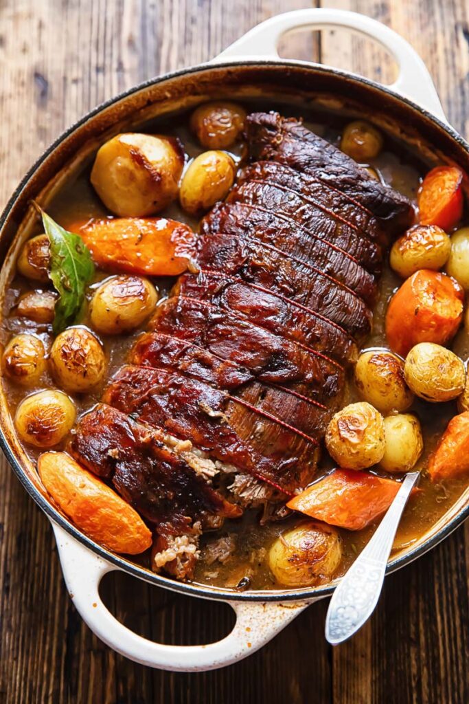 Top down shot of beef pot roast with potatoes and carrots