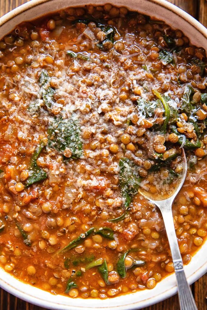 Top down of lentil and spinach soup in a large bowl