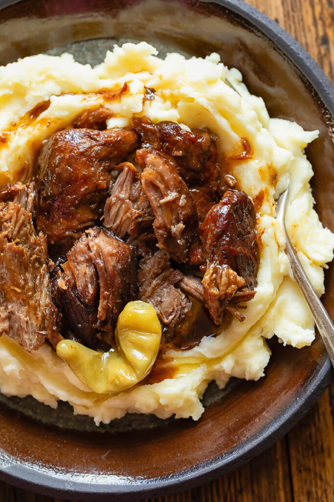 Pot roast with pickled chilies on mash potatoes