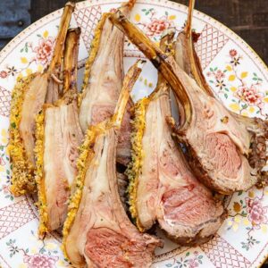 Rack of lamb pieces roasted with breadcrumbs on a plate