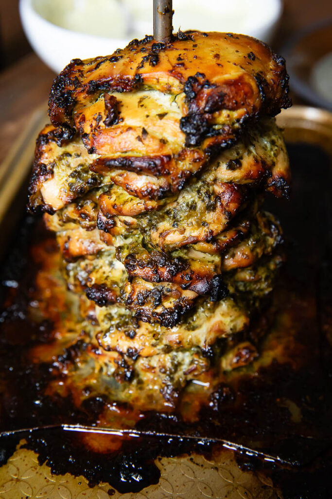 Close up shot of roasted cilantro lime chicken on a skewer