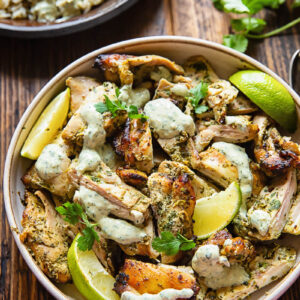 Top down shot of cilantro lime chicken in a bowl with creamy sauce