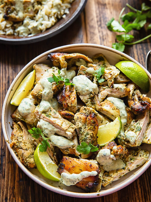 Top down shot of cilantro lime chicken in a bowl with creamy sauce