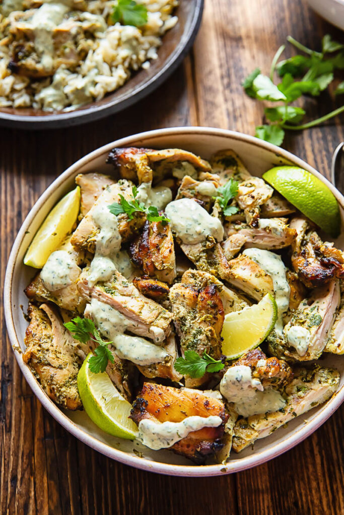Top down shot of cilantro lime chicken in a bowl with creamy sauce