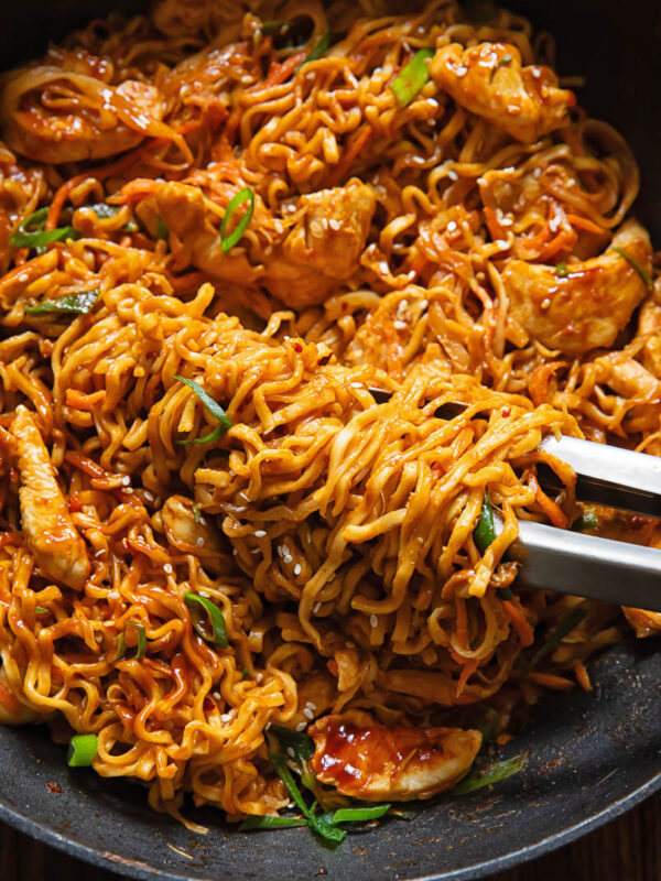Close up shot of peanut chilli noodles in a pan