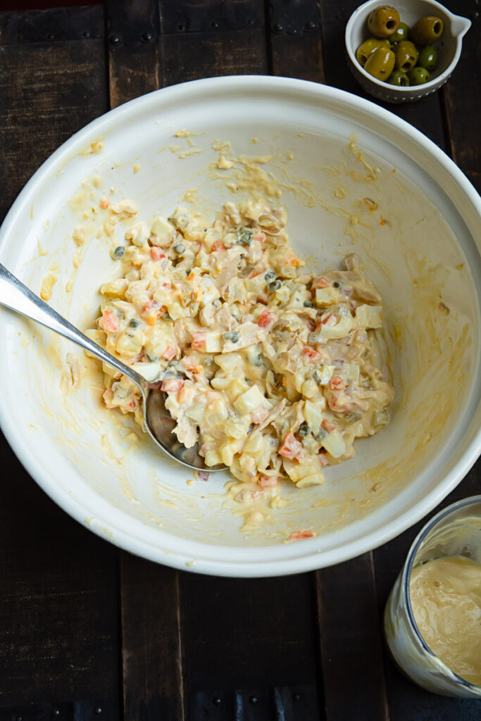 Top down shot of ensaladilla rusa in a large bowl