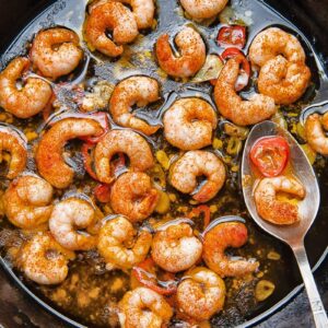 Close up shot of prawns with chilli oil in a pan