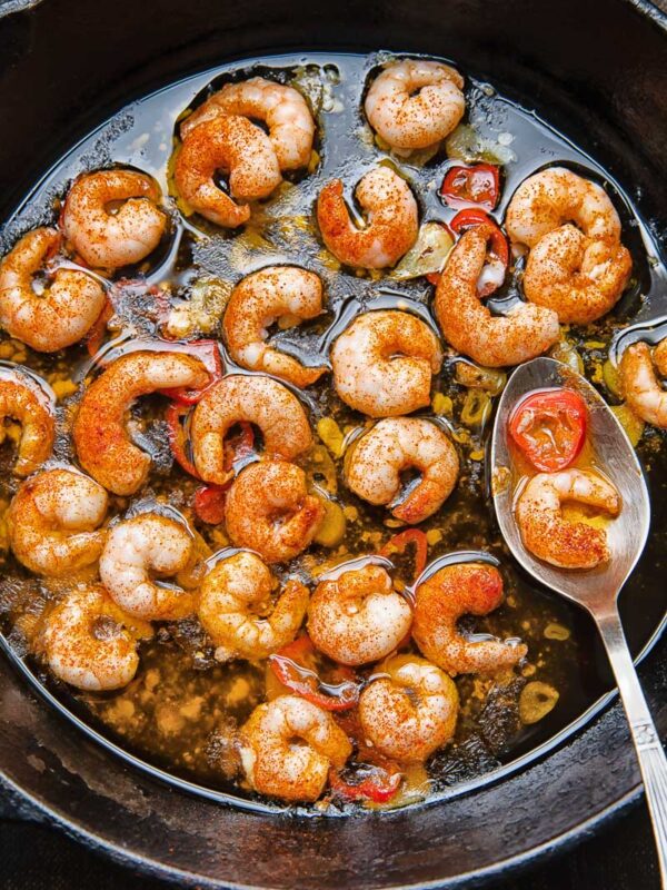 Close up shot of prawns with chilli oil in a pan