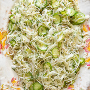 Top down shot of cabbage and cucumber slaw