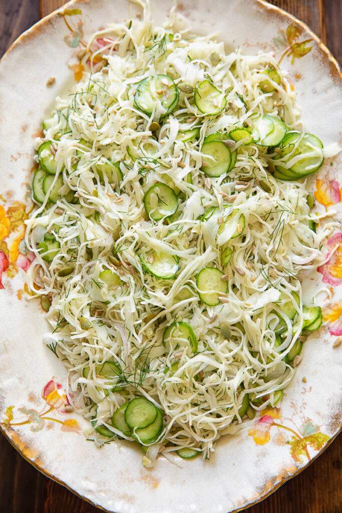 Top down shot of cabbage and cucumber slaw