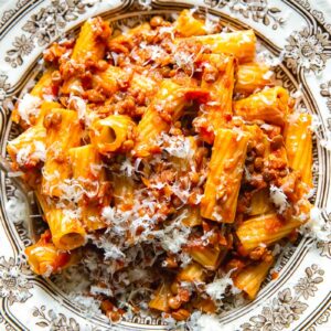 Top down shot of lentil bolognese in a bowl of pasta