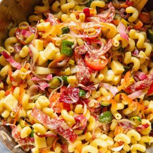 vertical shot of Italian pasta salad oil a sliver bowl
