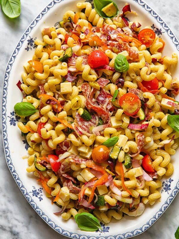 vertical shot of Italian pasta salad on a white platter