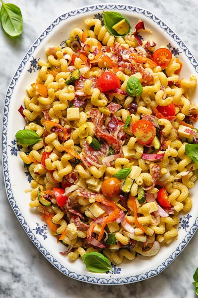 vertical shot of Italian pasta salad on a white platter
